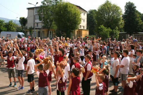 Children holding teddy bears